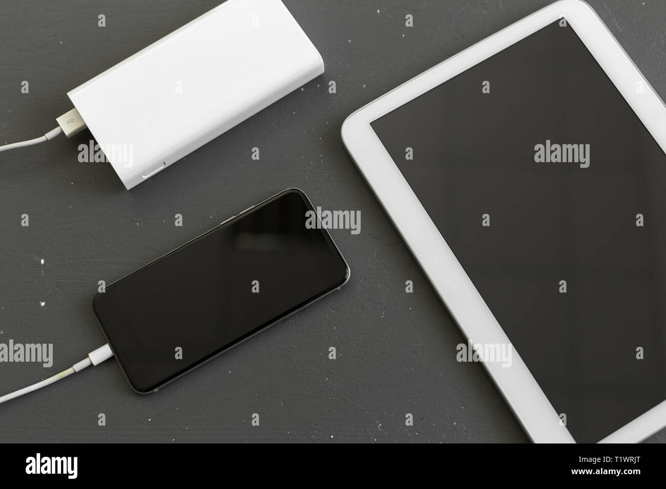 Smartphone charging with power bank Stock Photo Alamy