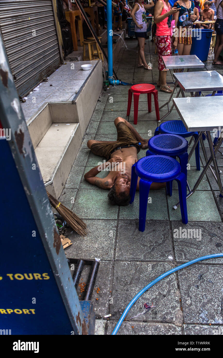 Drunk man in Khao San road, Bangkok, Thailand Stock Photo