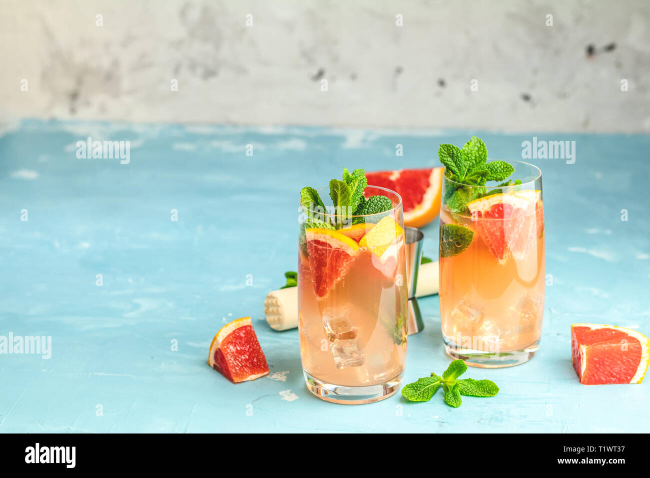 Grapefruit and fresh mint cocktail with juice, cold summer citrus