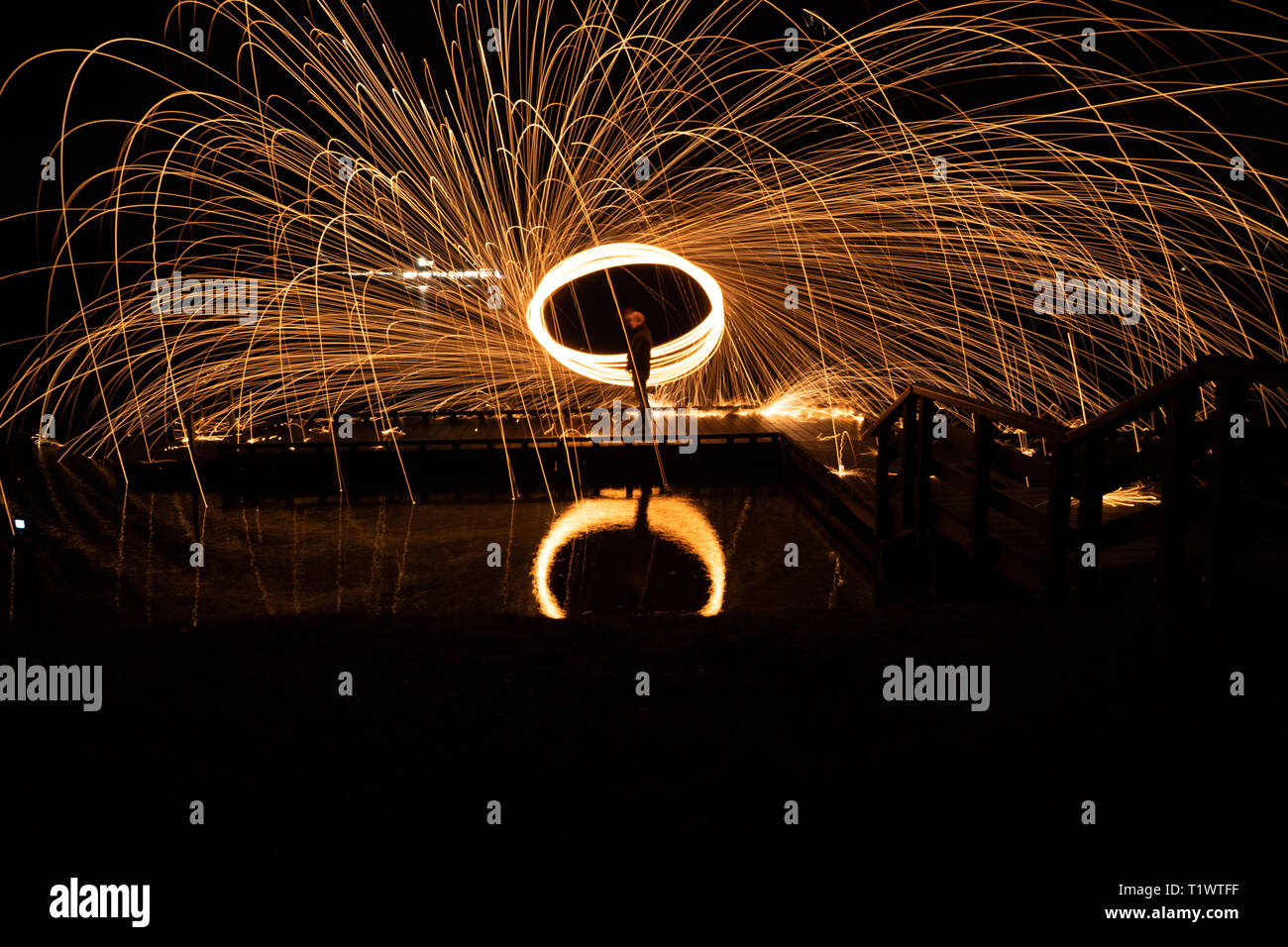Burning steel wool as fireworks with fire splashes Stock Photo Alamy