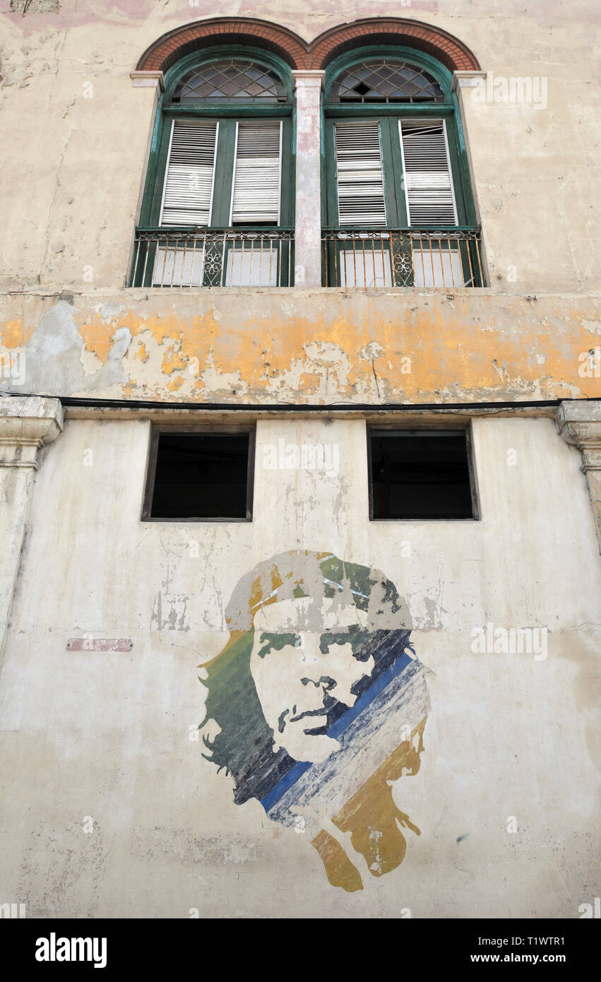 An iconic image of Cuban Revolution figure Ernesto 'Che' Guevara is painted on the wall of a building in Havana, Cuba. Stock Photo