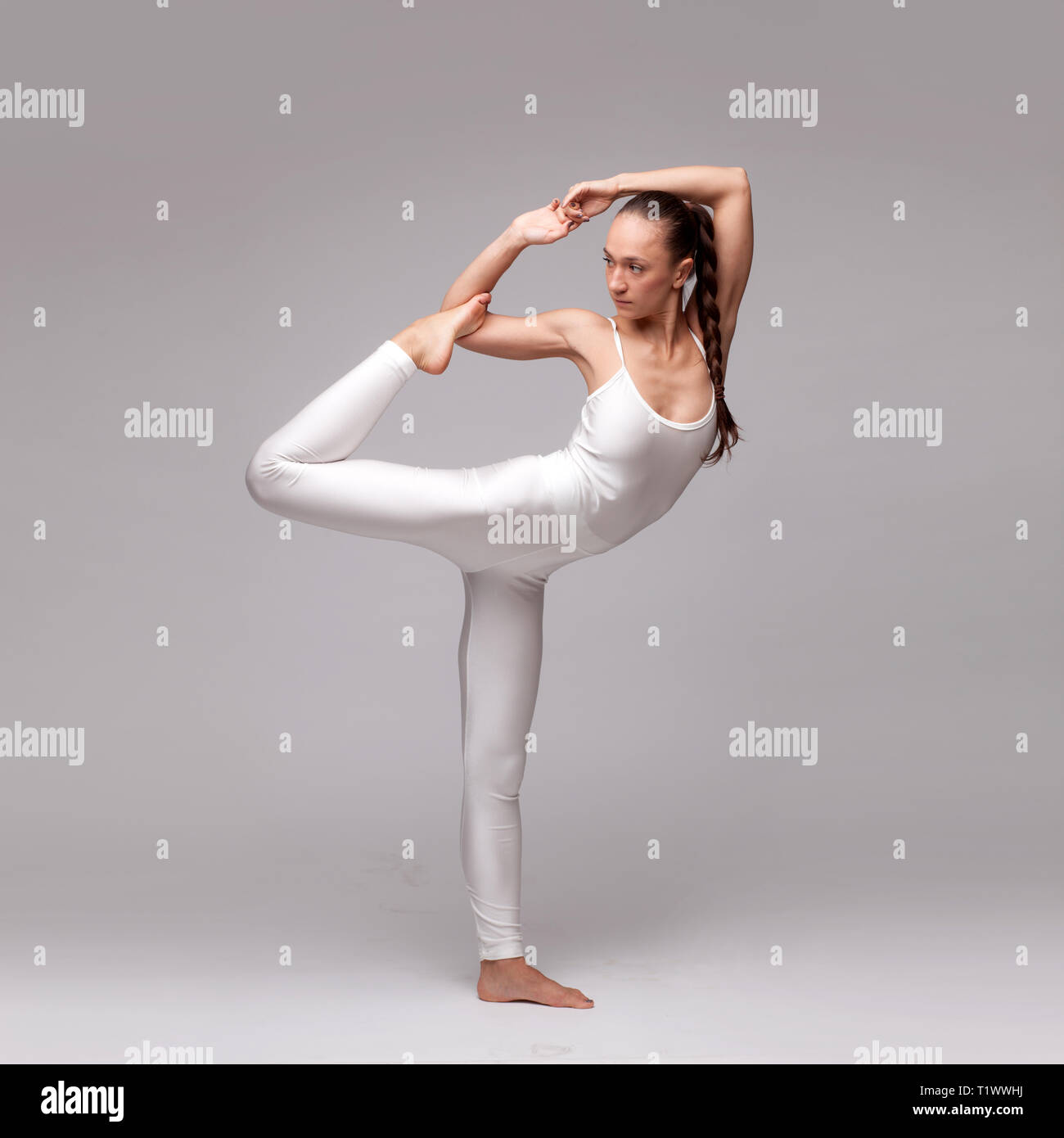 young beautiful woman yoga posing. isolated Stock Photo - Alamy