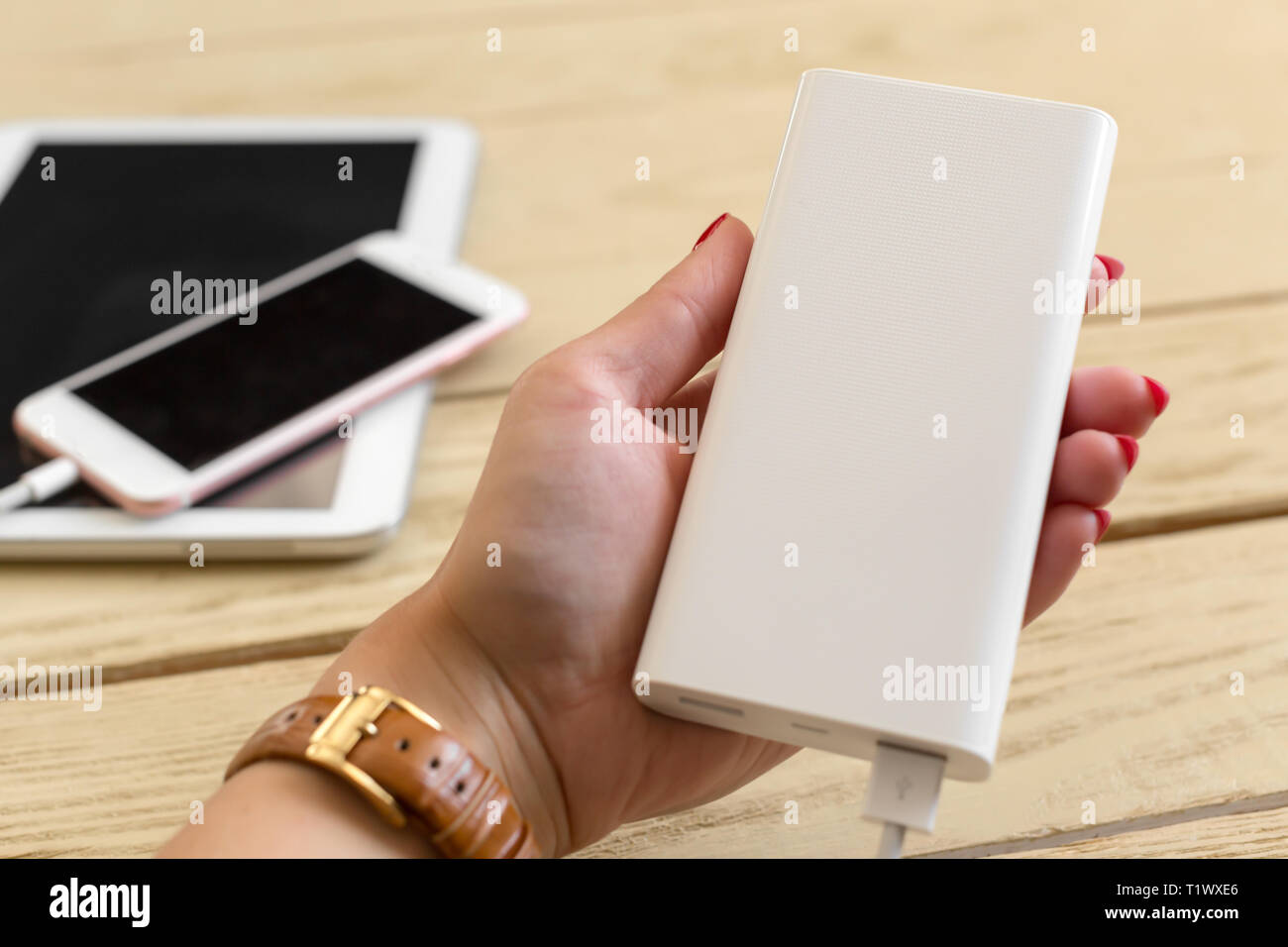 Smartphone charging with power bank Stock Photo Alamy