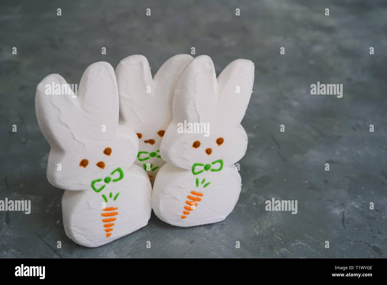 White Marshmallow bunnies - Easter background, selective focus Stock Photo