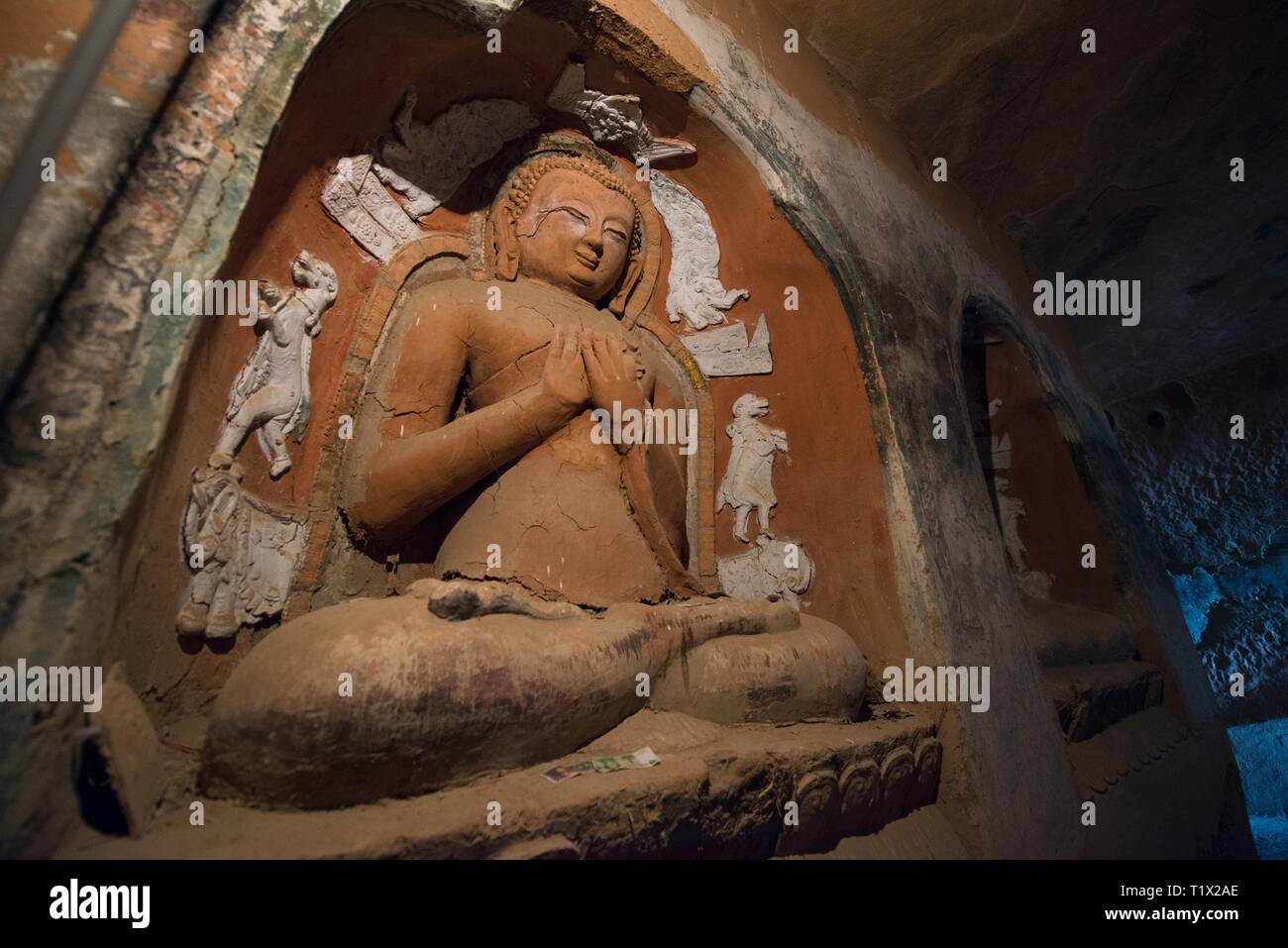 A Buddha statue in Mati Si temple, also called Horse's Hoof Temple in the rock caves, Sunan, Zhangye, Gansu, China Stock Photo