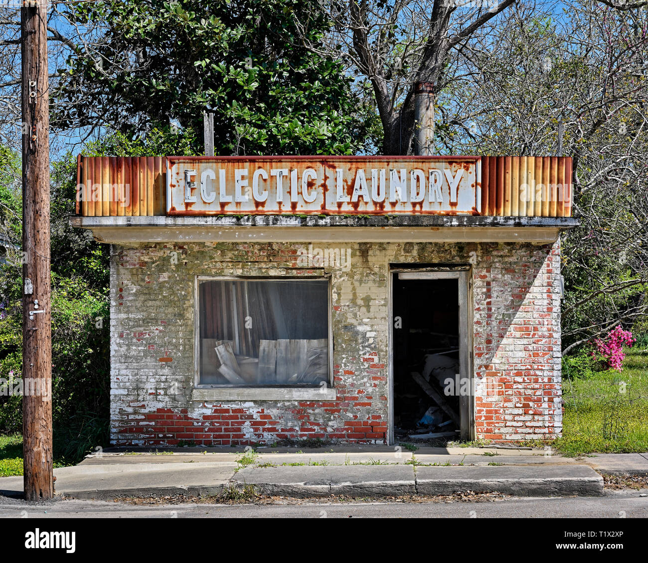 Abandoned and deserted closed Eclectic Laundry business old brick building in rural Eclectic Alabama, USA. Stock Photo