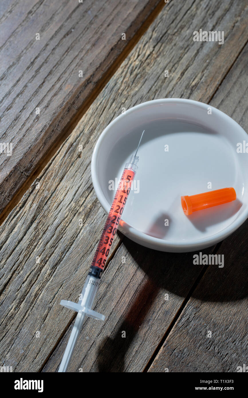 hypodermic needle full of vitimin B12 Stock Photo Alamy