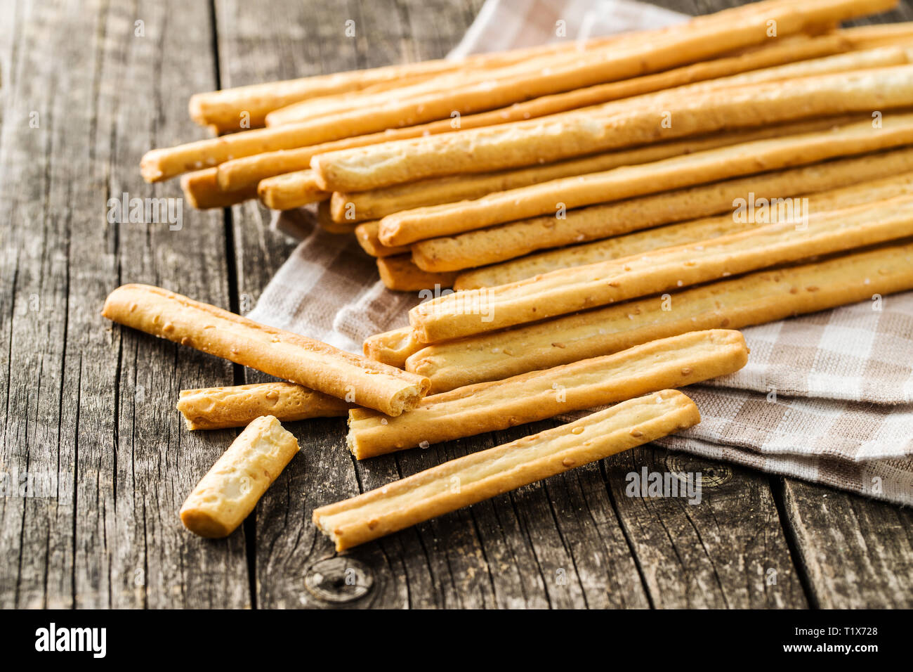 Italian grissini breadsticks. Tasty grissini snack on old wooden table  Stock Photo - Alamy