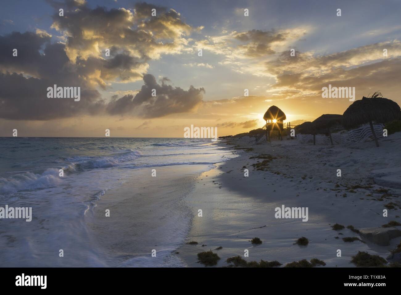 Dramatic Sky and Beautiful Sunset on Tropical Sand Beach in Cayo Largo Del Sur Island in Caribbean Sea off the Cuba Coast Stock Photo