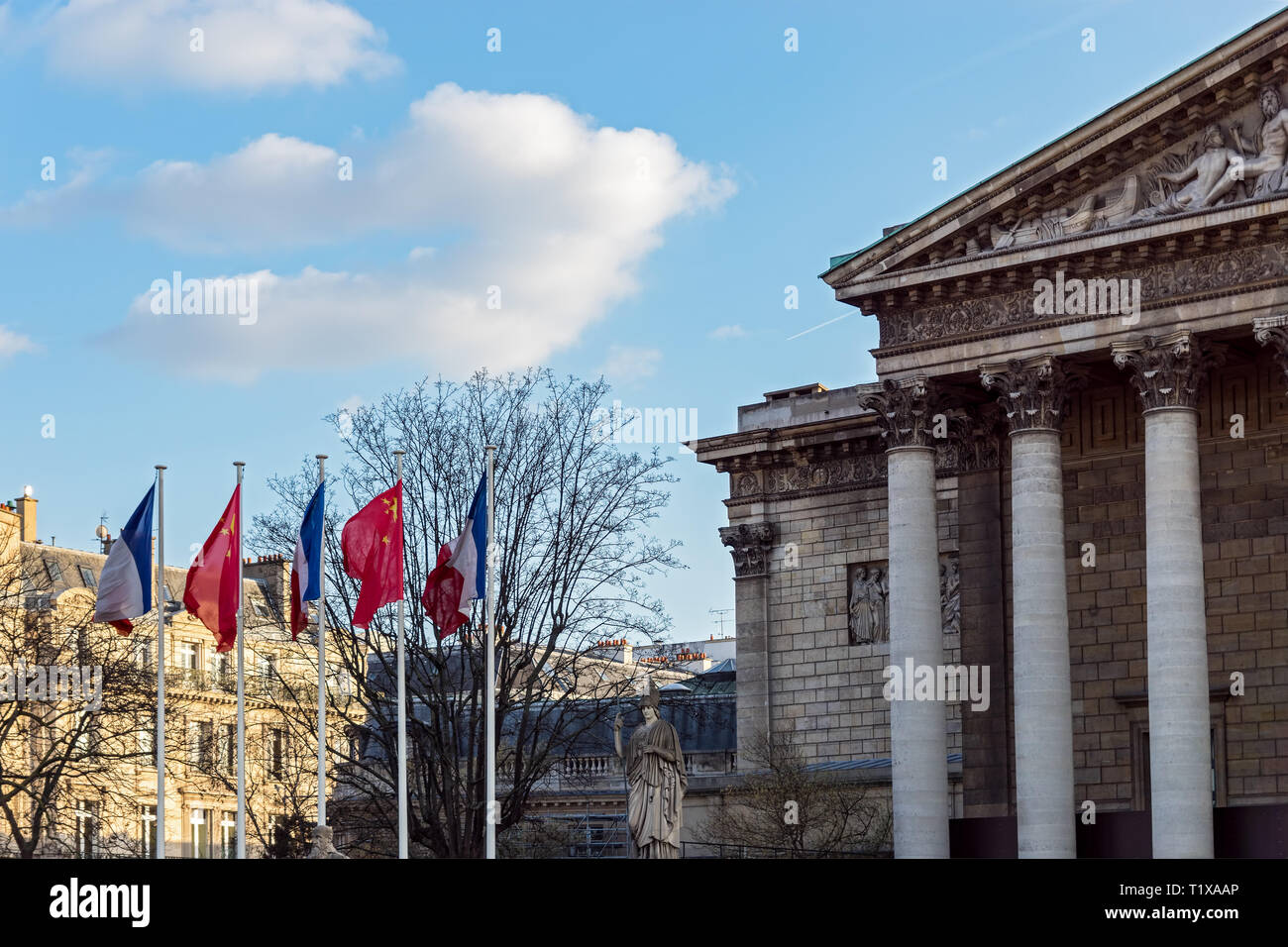 Paris: French and Chinese flags in the wind in front of National Assembly Stock Photo