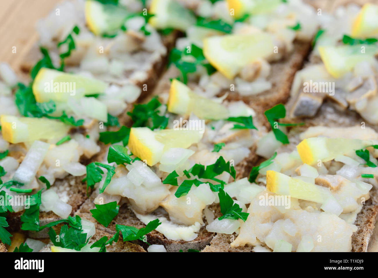 sandwiches with herring tartare on plate Stock Photo Alamy