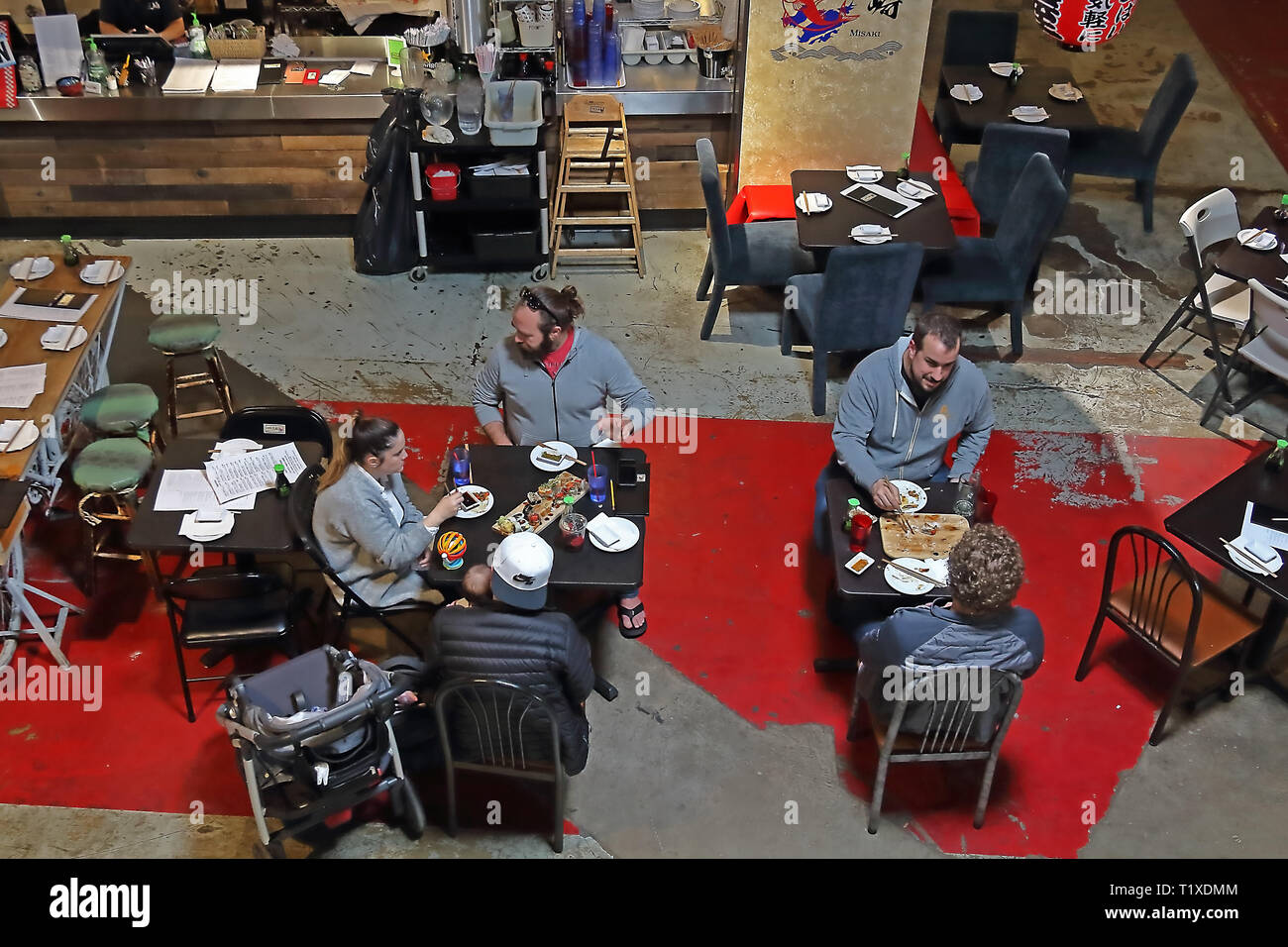 Aurora, Colorado - March 23, 2019: Stanley Marketplace, airy warehouse hangout housing multiple food vendors, along with other retailers and business Stock Photo