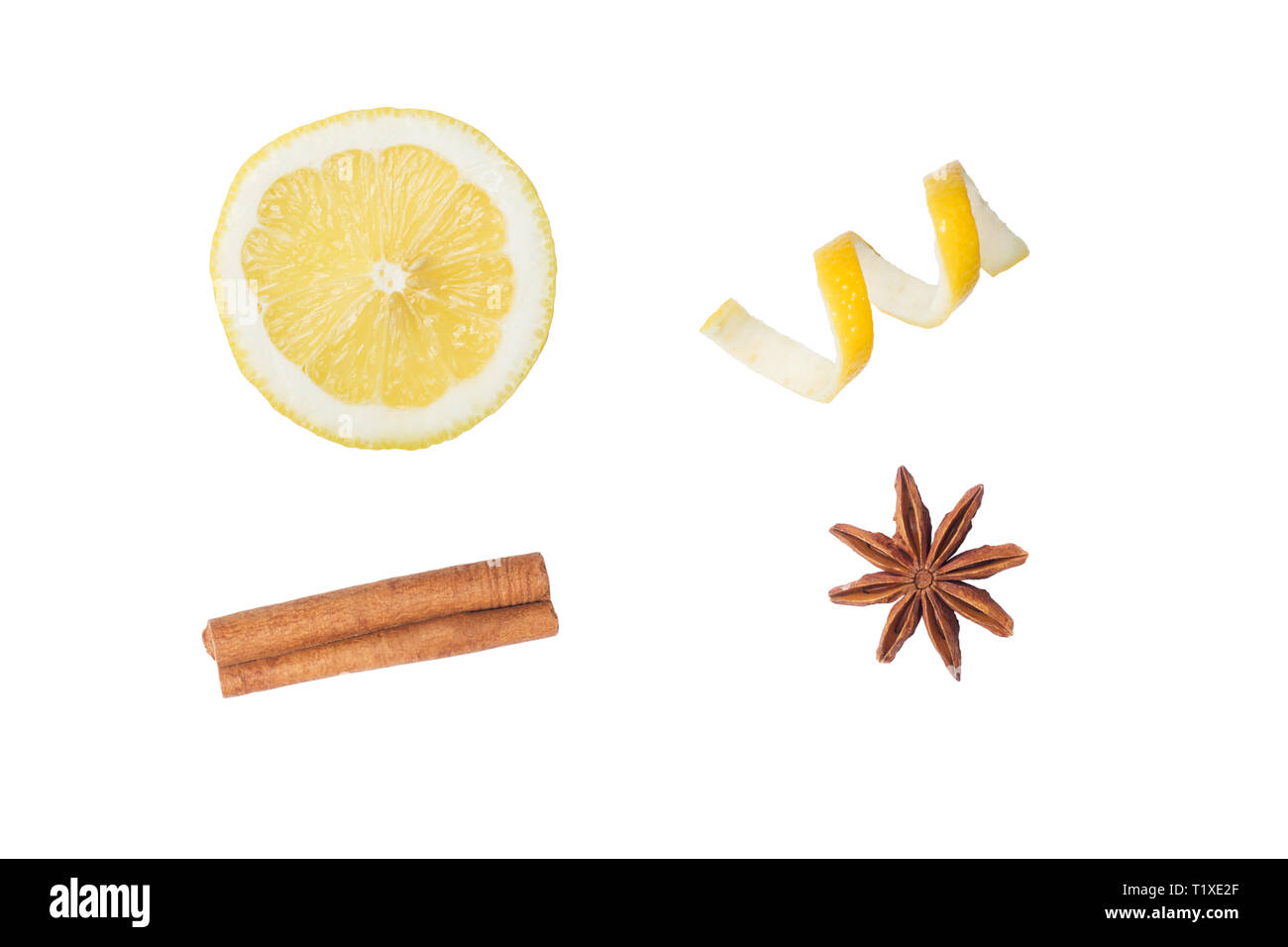 Longitudinal section of lemon and lemon peel chips. Cinnamon stick and