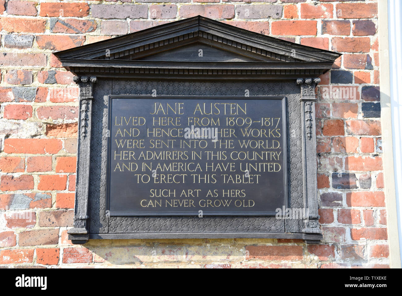 Plaque/tablet outside Jane Austen’s House, Chawton, near Alton, Hampshire, UK. Sunday 24 February 2019. Stock Photo