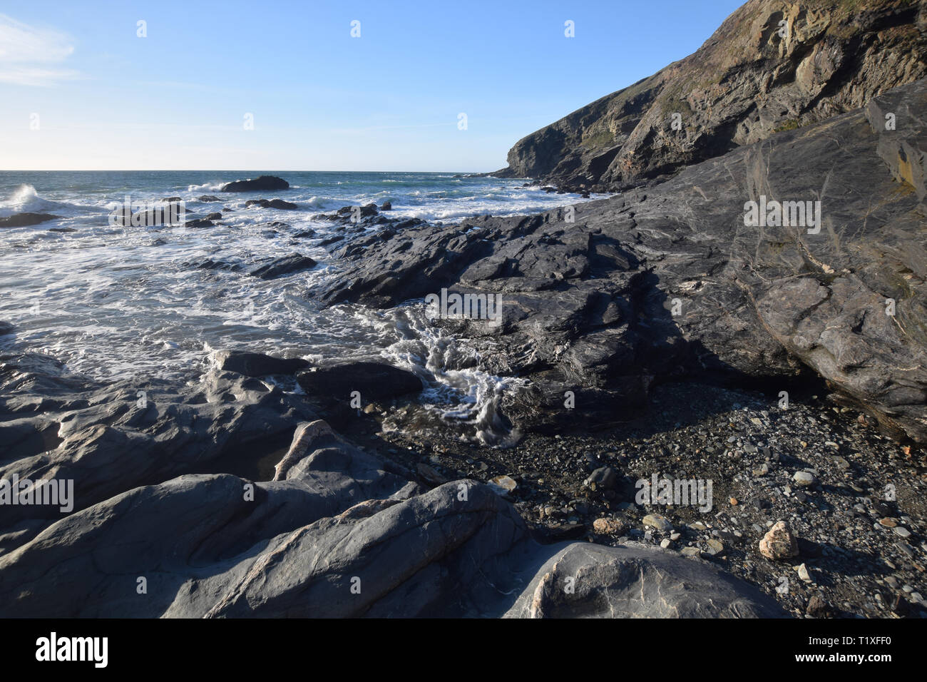 Incoming tide Tregardock Beach Cornish Coast Stock Photo