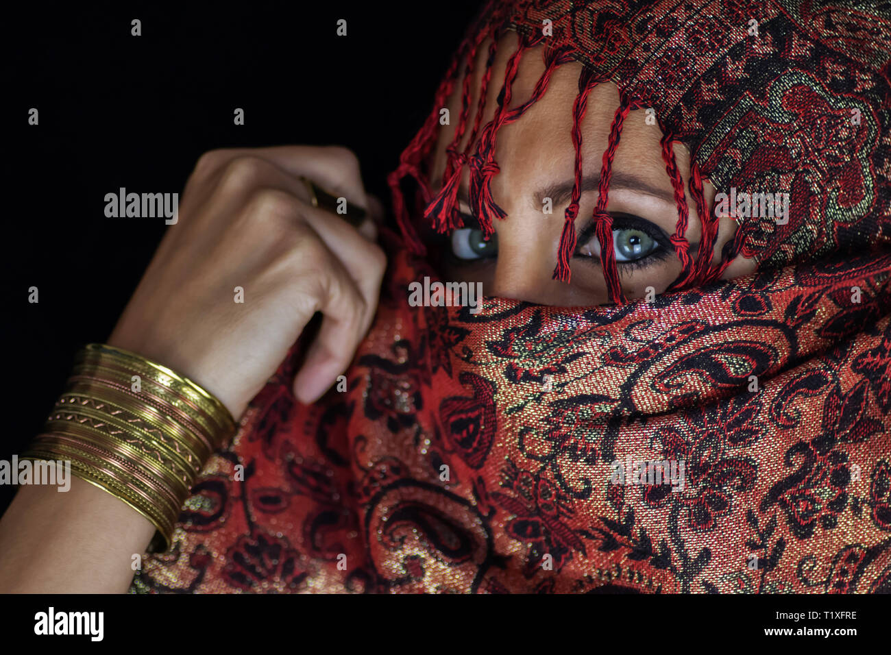 Scarf from Afghanistan around girl with beautiful green eyes Stock Photo