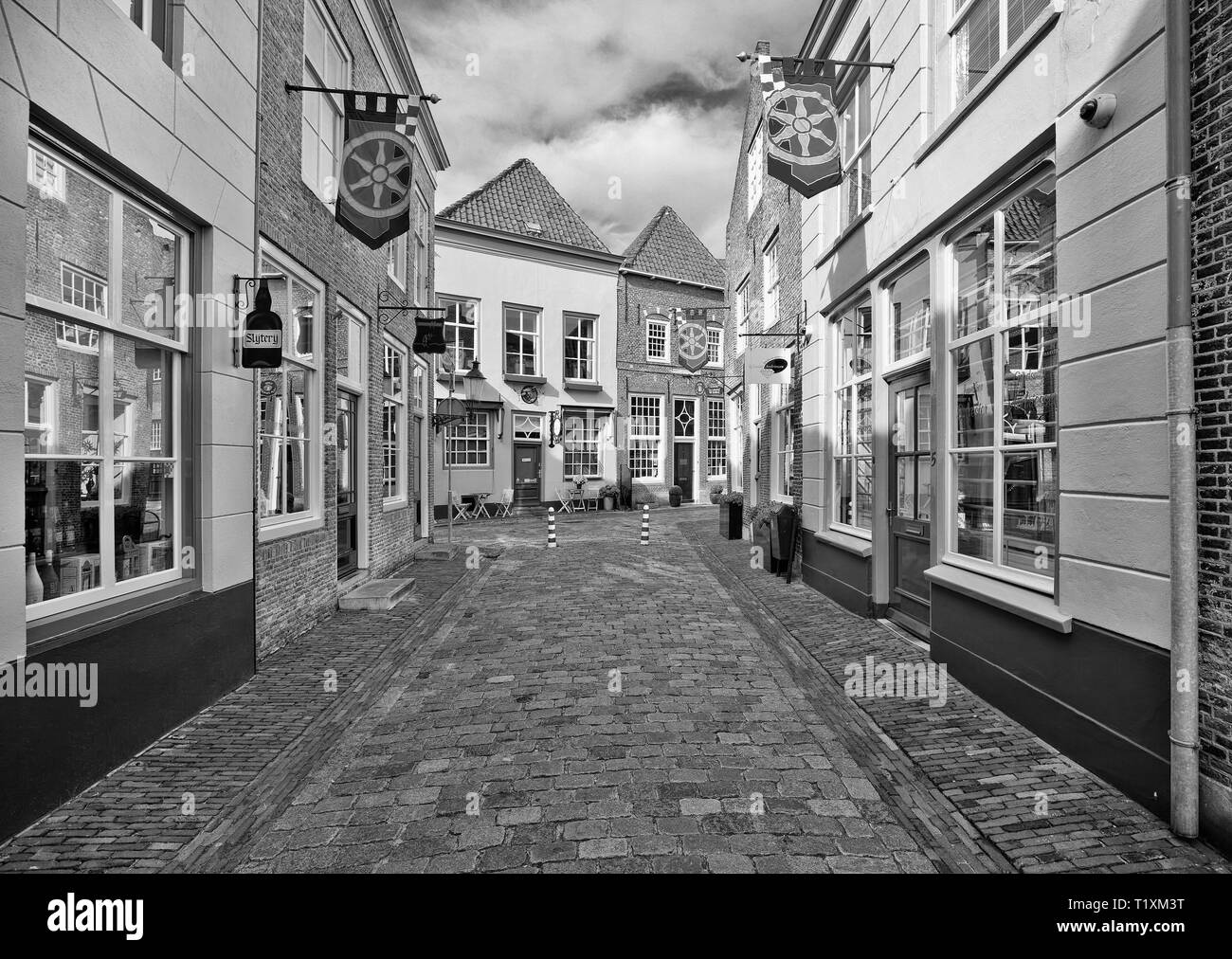 Ancient alley with shops. Heusden currently draws over 350 thousand tourists annually who visit the historic town and walk the ancient fortress walls. Stock Photo