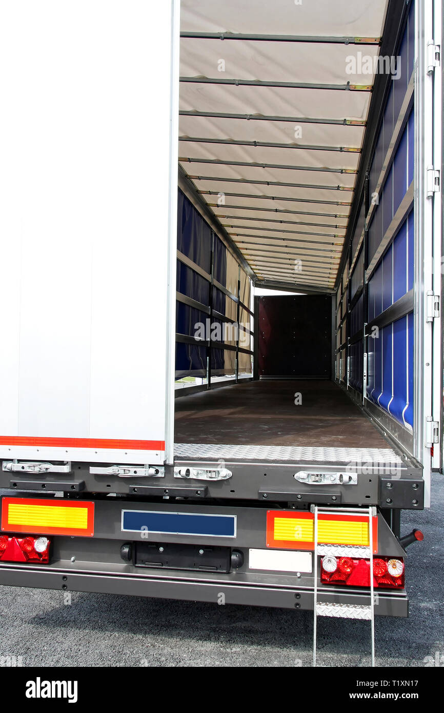 Rear view of empty lorry and open door Stock Photo - Alamy