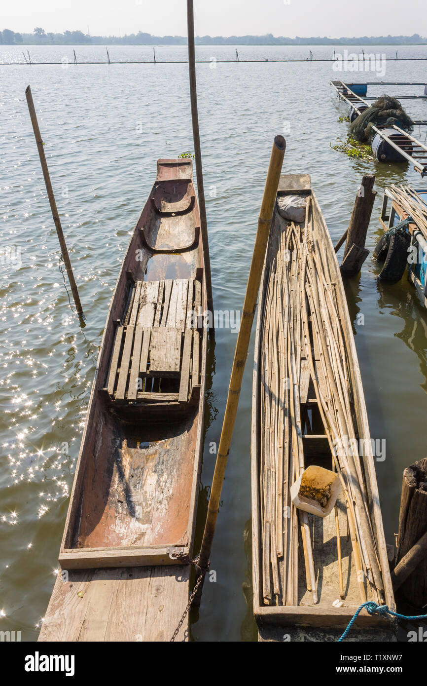 Wood Fishing Boat or Rowboat on Swamp with Wood Boat Pole Portrait