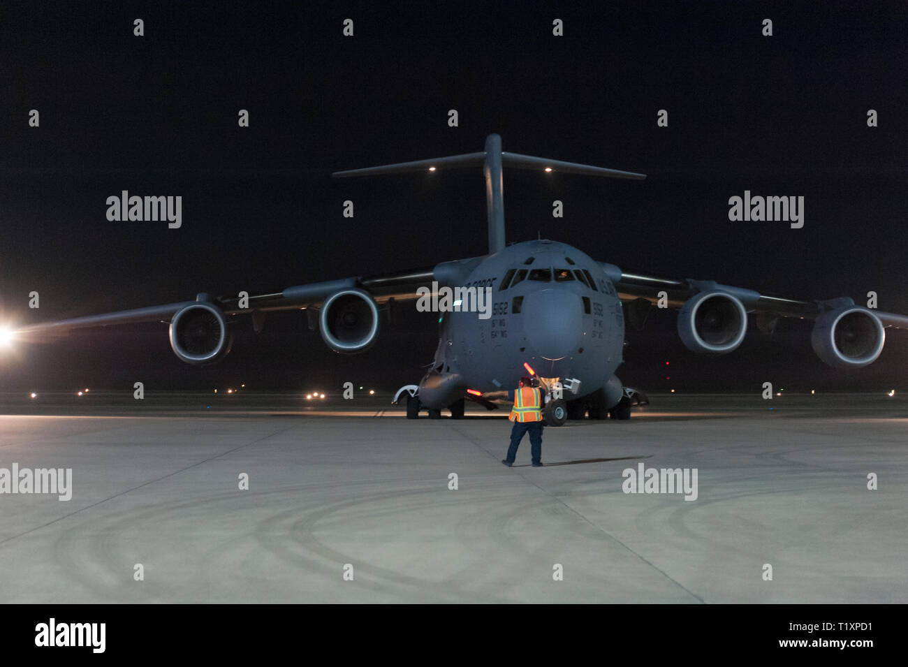 A C-17 Globemaster III assigned to Joint-Base Pearl Harbor-Hickam taxis onto Laughlin Air Force Base, Texas, Feb. 5, 2019. Soldiers assigned to 503rd Military Police Battalion, 66th Military Police Company, and 550th Medical Company Area Support departed Arizona to support Customs and Border Protection in Eagle Pass, Texas. The Department of Defense has deployed units across the Southwest Boarder at the request of U.S. Customs and Border Protection and is providing logistical, engineering, and force protection functions. Stock Photo