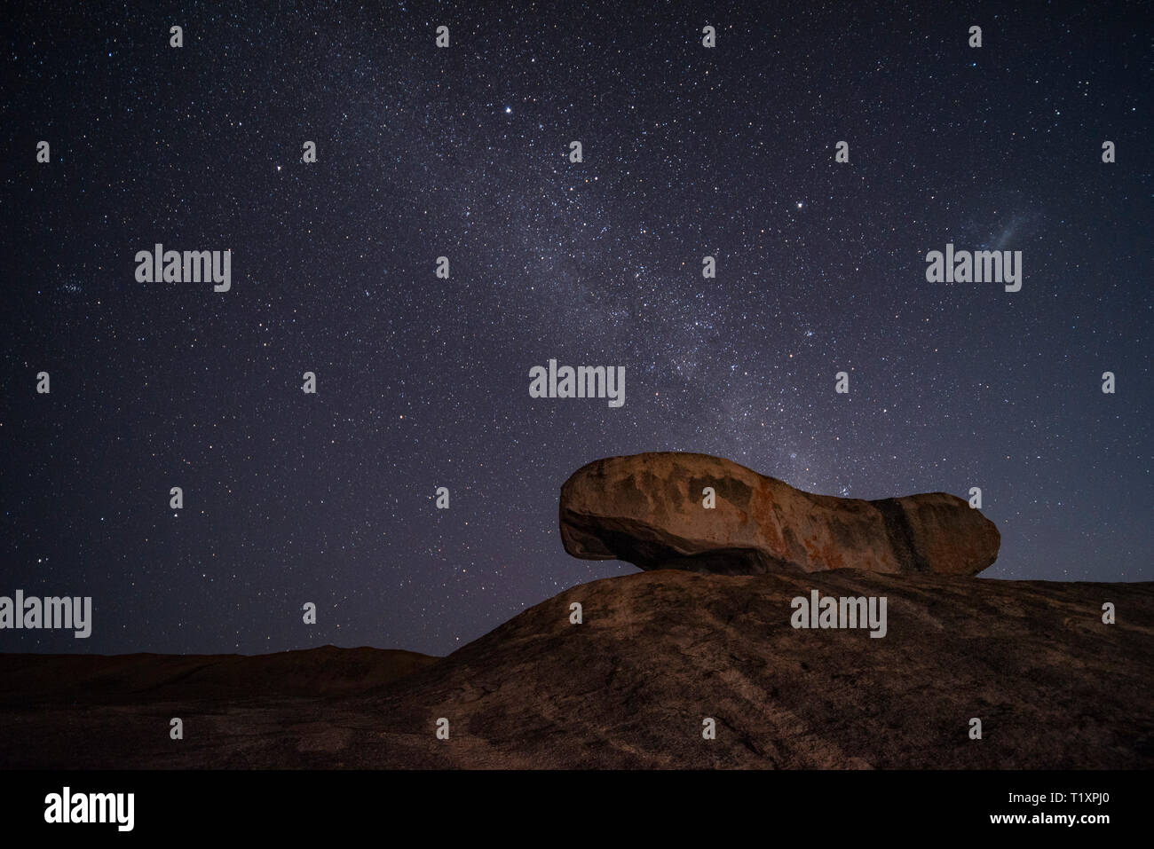 A man watches a starry African sky in Zimbabwe. Stock Photo