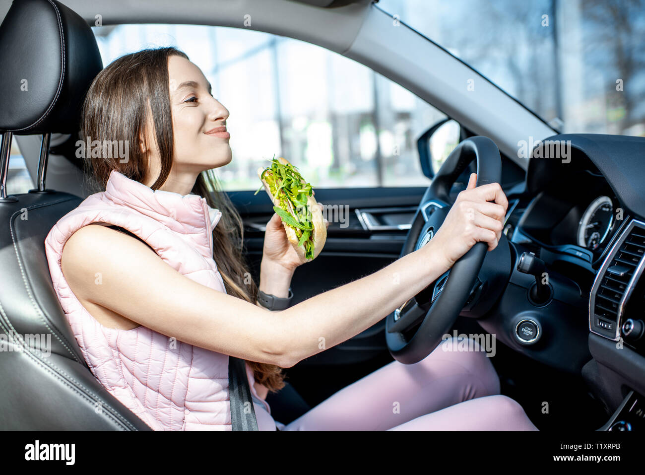 Car eating young woman hi-res stock photography and images - Page 2 - Alamy