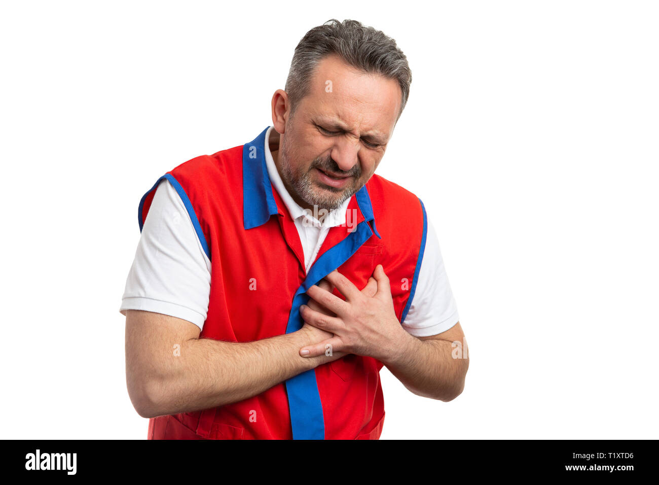 Male supermarket or hypermarket employee touching chest as having cardiac problem isolated on white studio background Stock Photo