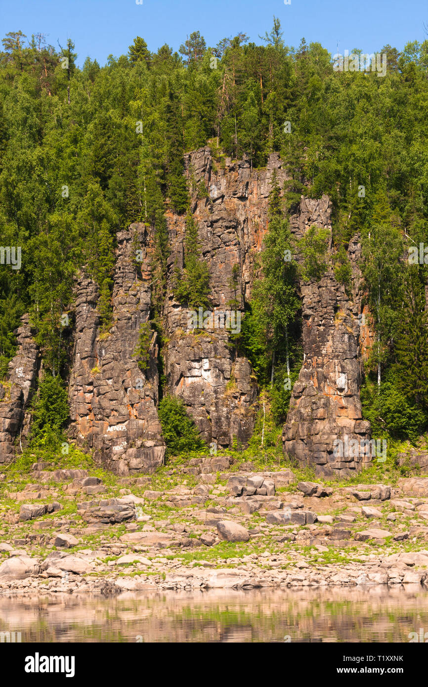 Fantastical cliffs on the river. Around only rocks and trees ...
