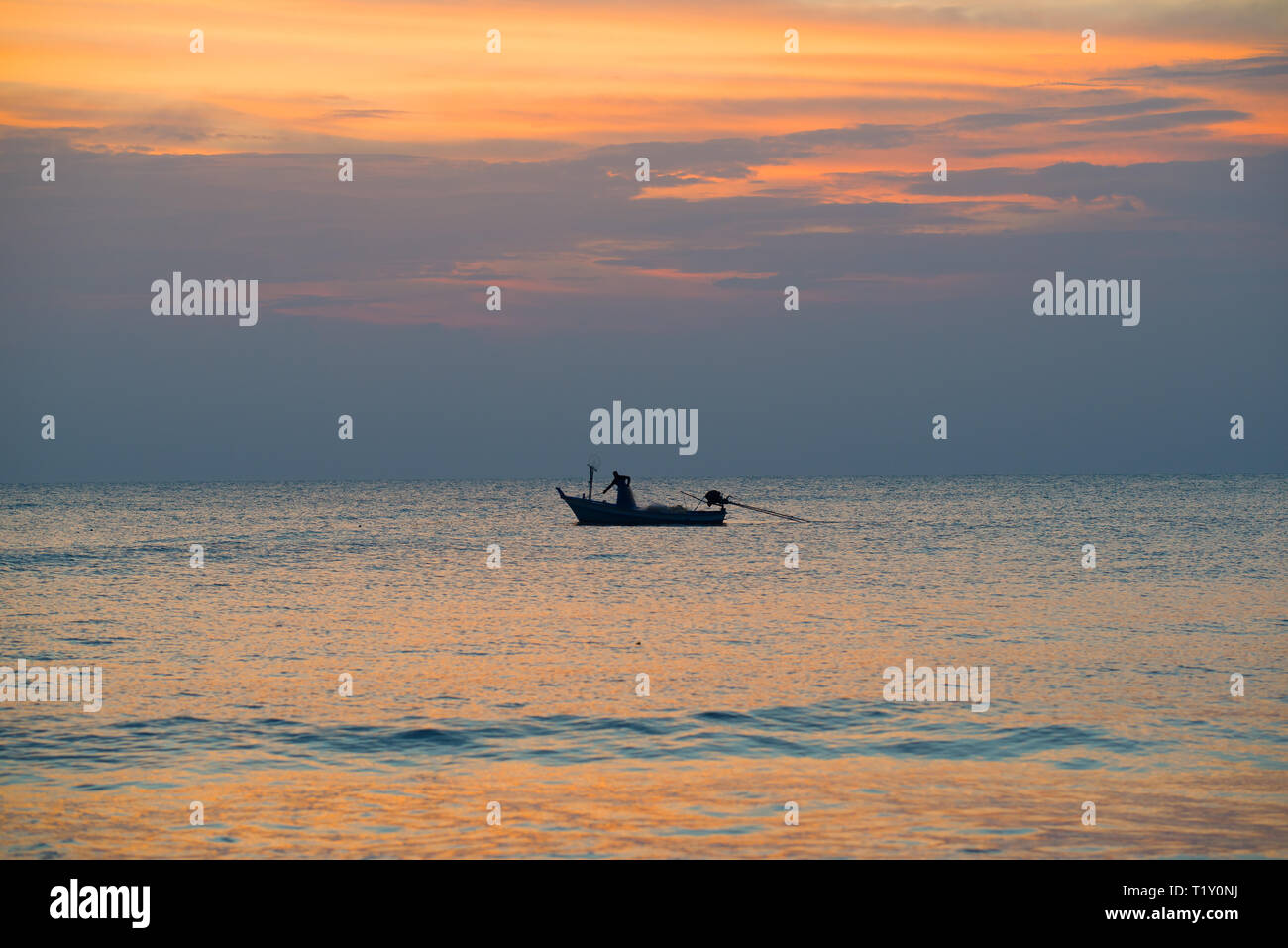 Fisherman on a boat in the Gulf of Siam at sunset background. Thailand ...