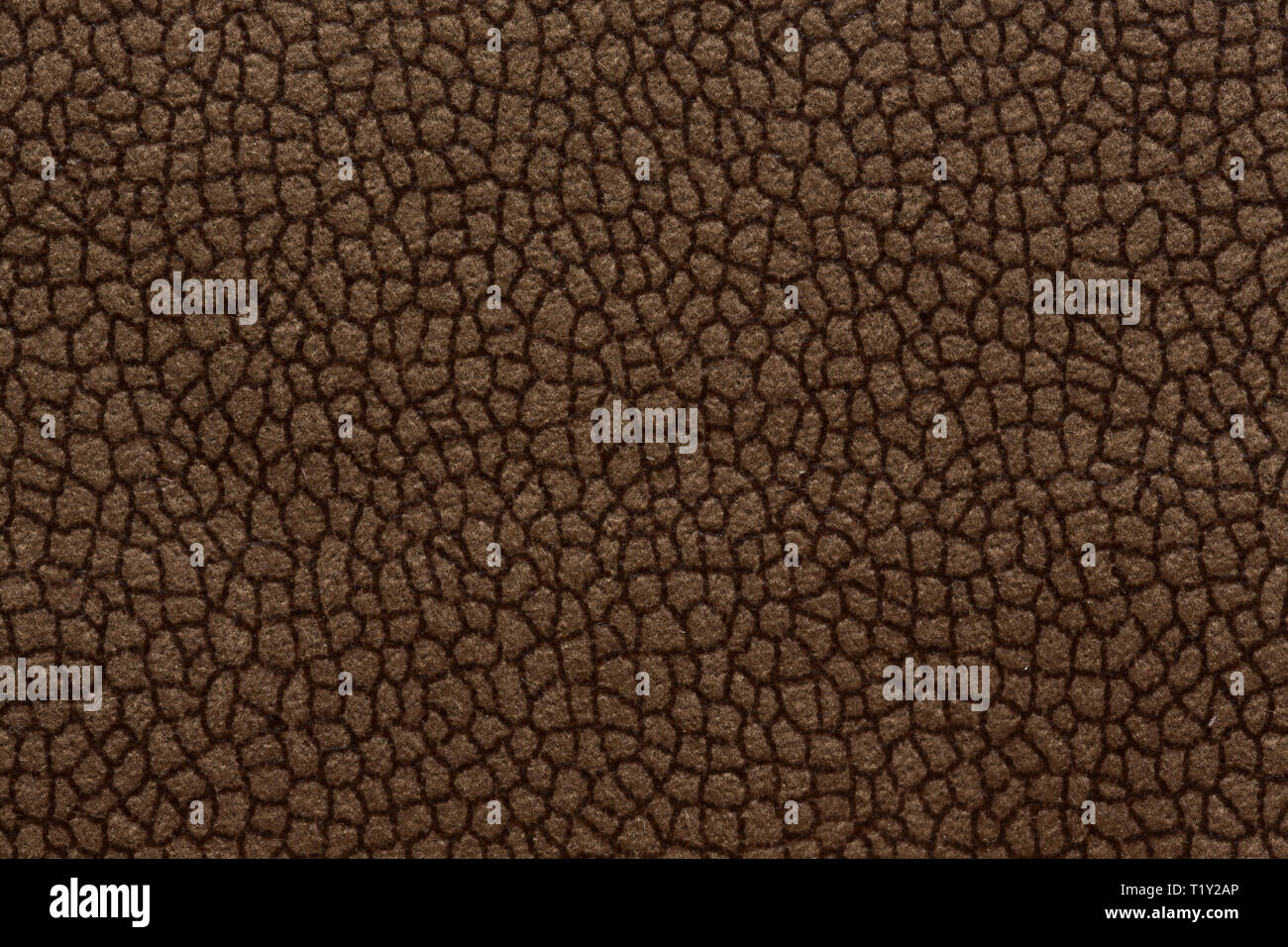 Dark textile background with ornamental surface. Brown textile texture. Stock Photo