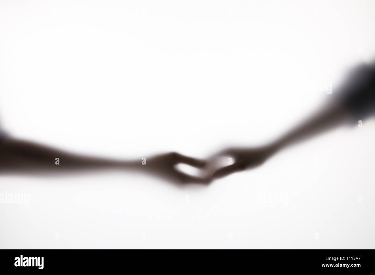 Two hands touching silhouette hi-res stock photography and images - Alamy