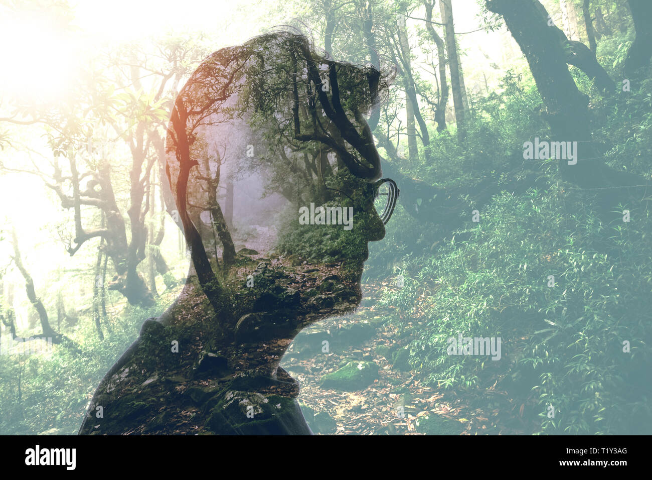 Double exposure of man in glasses and green forest Stock Photo - Alamy