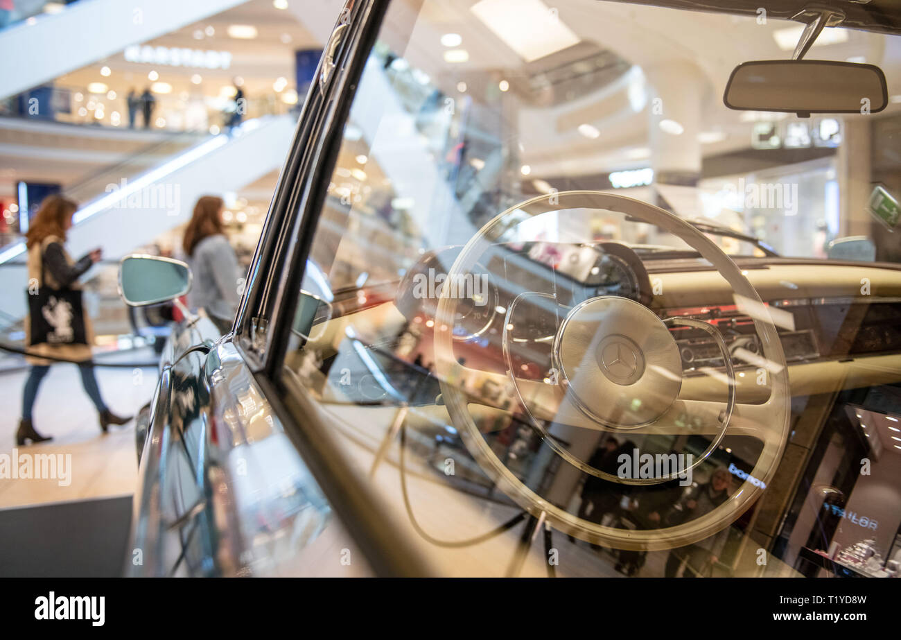 Essen, Germany. 29th Mar, 2019. A Mercedes-Benz 220/280 SE (b) Coupé from 1962 is on display in the Limbecker Platz shopping centre. For the announcement of the TechnoClassica trade fair from 10-14 April, some vehicles from the classic car fair can already be admired in advance for a few days in the shopping centre. Credit: Bernd Thissen/dpa/Alamy Live News Stock Photo