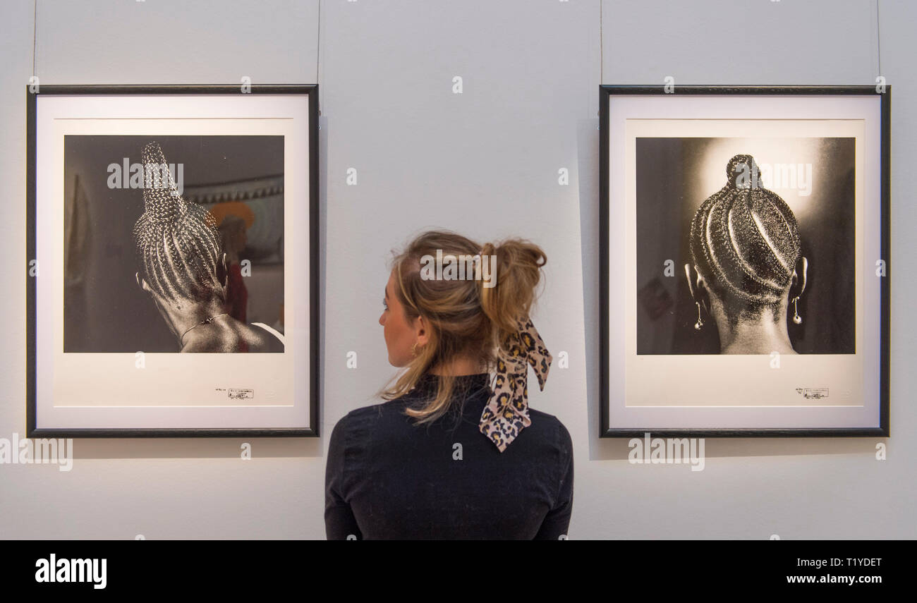 Sotheby’s London, UK. 29 March, 2019. Pre-sale exhibition of Modern and Contemporary African Art, showing the work of artists from across the African diaspora. Image: J.D. ‘Okhai Ojeikere, Hairstyles Series. Estimate (each) £3,000-5,000. Credit: Malcolm Park/Alamy Live News. Stock Photo