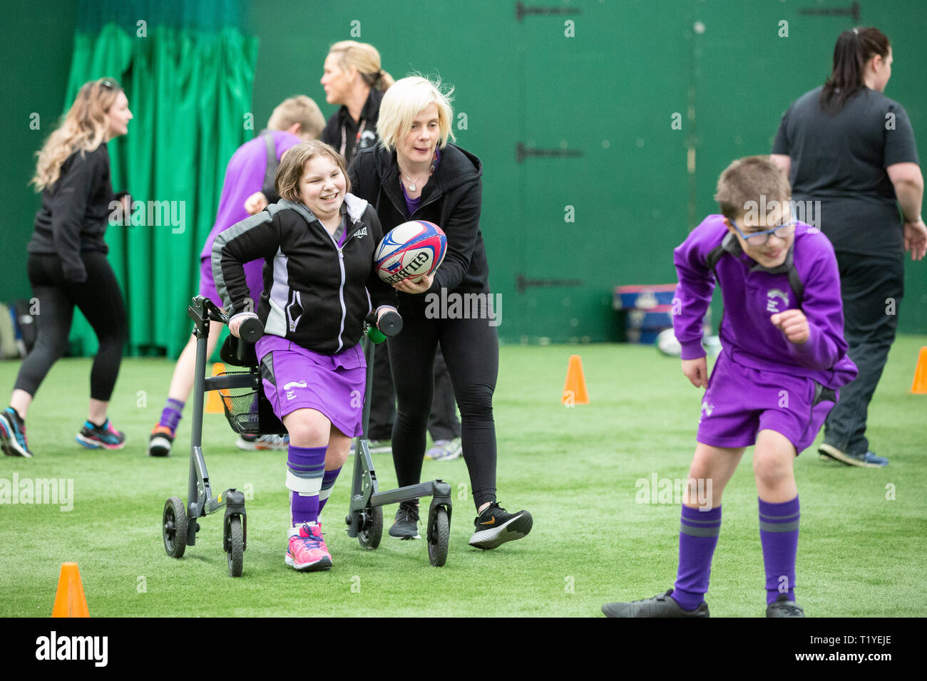 Llandarcy Academy of Sport, Swansea, Wales, UK. Friday 29 March 2019.  Participants at the WRU Disability Strategy Update event, where ten specially designed wheelchairs, a gift to the WRU, were used for the first time. Credit: Gruffydd Thomas/Alamy Live News Stock Photo