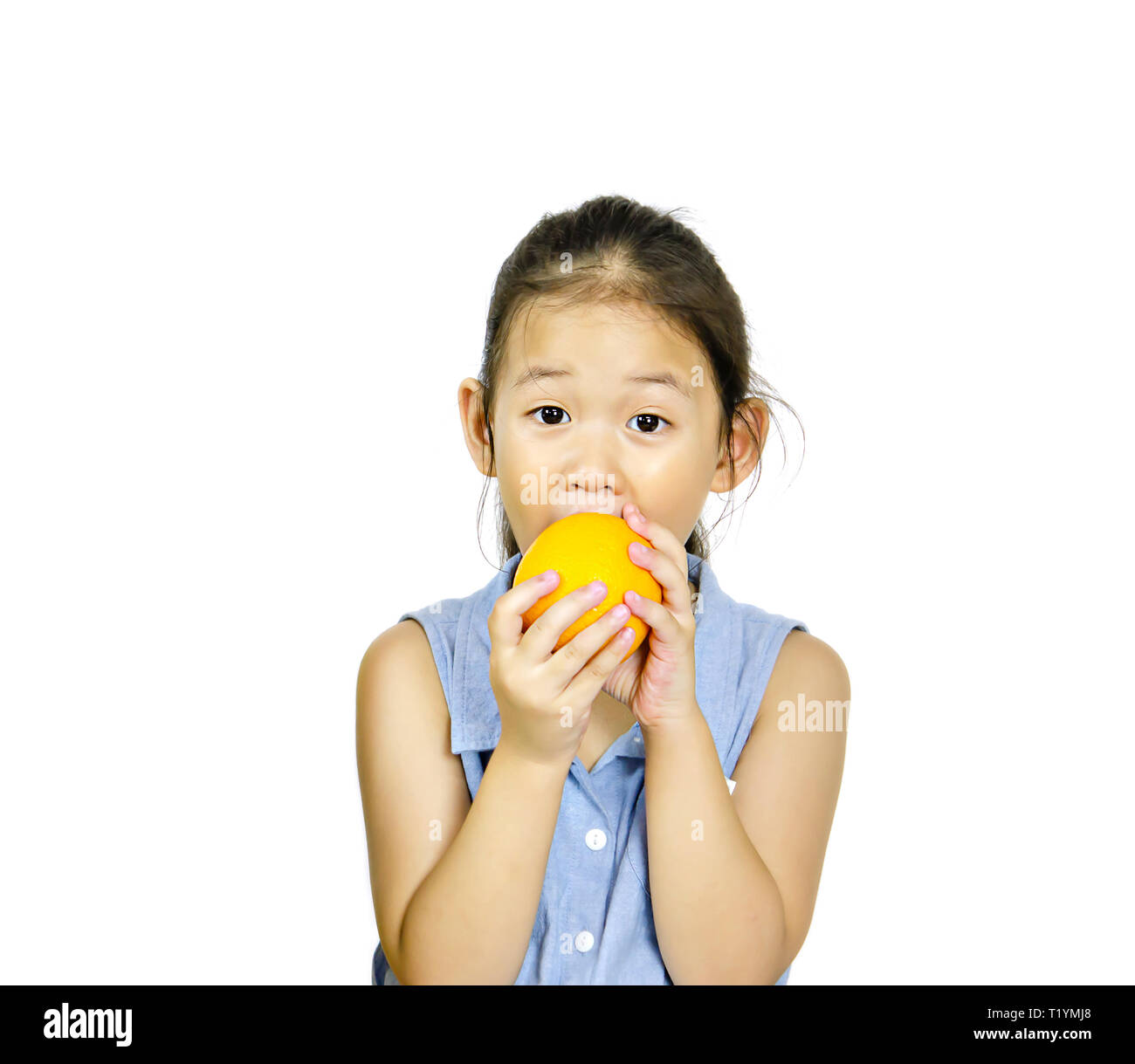 asian little girl holding fresh orange on white background Stock Photo ...