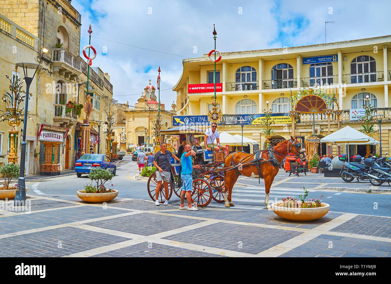 RABAT, MALTA - JUNE 16, 2018: The horse-drawn carriage is the best tourist transport to explore medieval city with its numerous landmarks, on June 16  Stock Photo