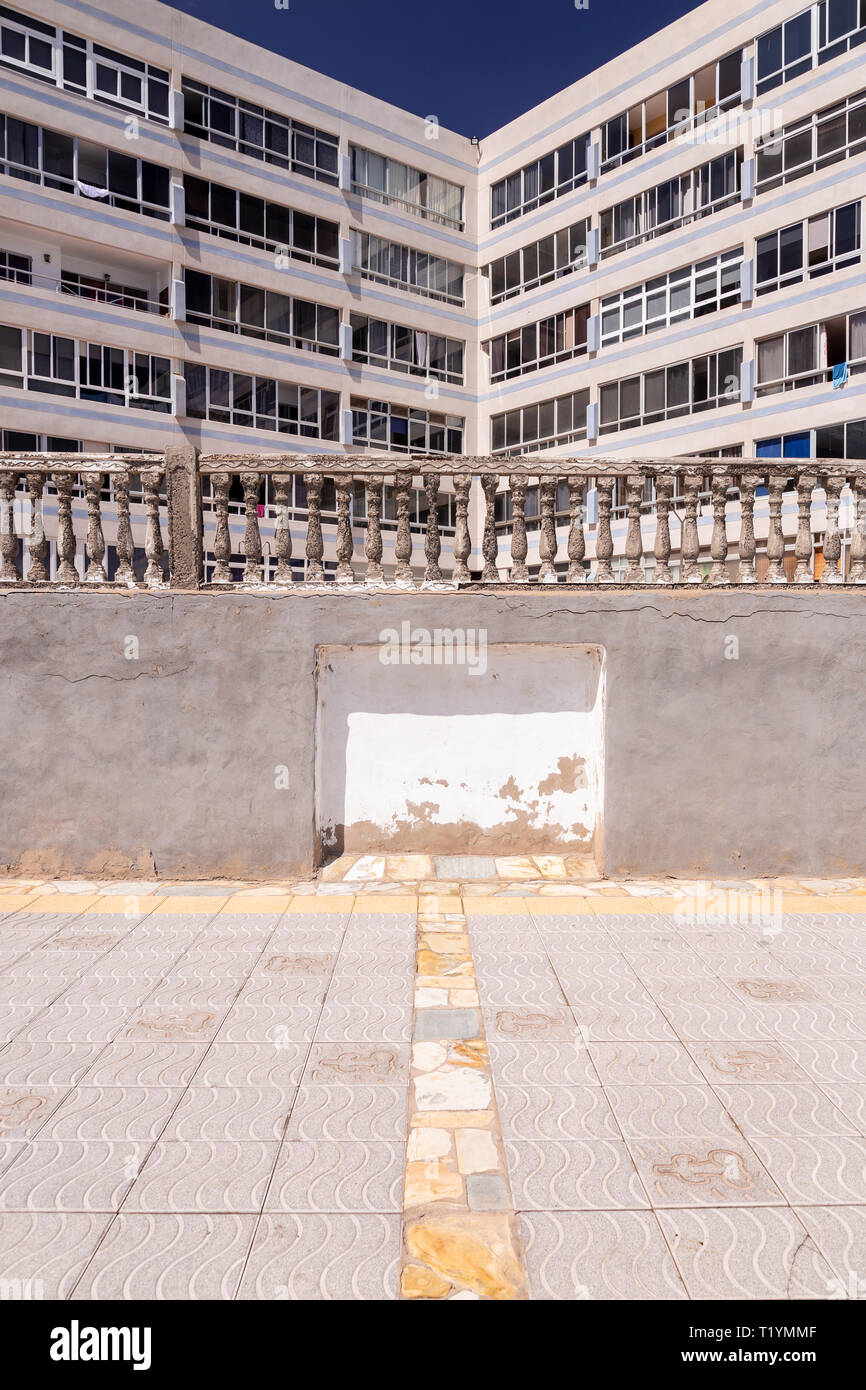 Decaying concrete balustrade and flats at La Garita, Gran Canaria, Canary Islands Stock Photo