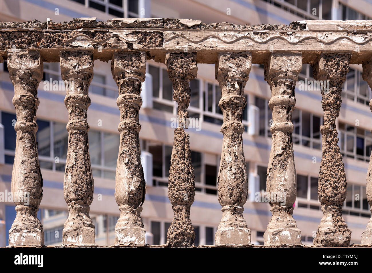 Decaying concrete balustrade and flats at La Garita, Gran Canaria, Canary Islands Stock Photo