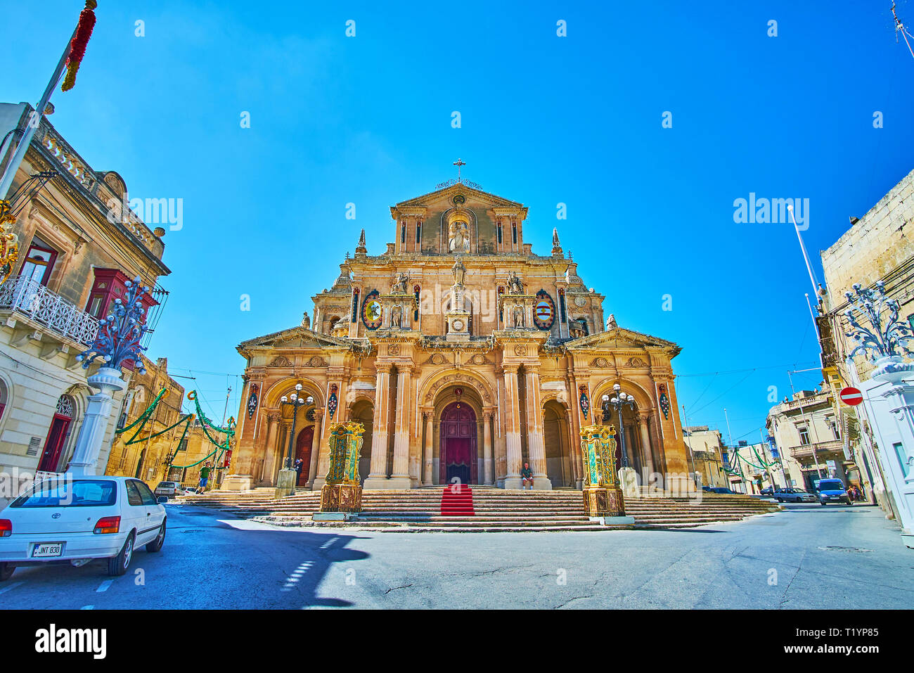 The scenic facade of the Parish Church of St Nicholas of Bari, decorated with garlands and lanterns due to the Feast of St Nicholas - the patron Saint Stock Photo