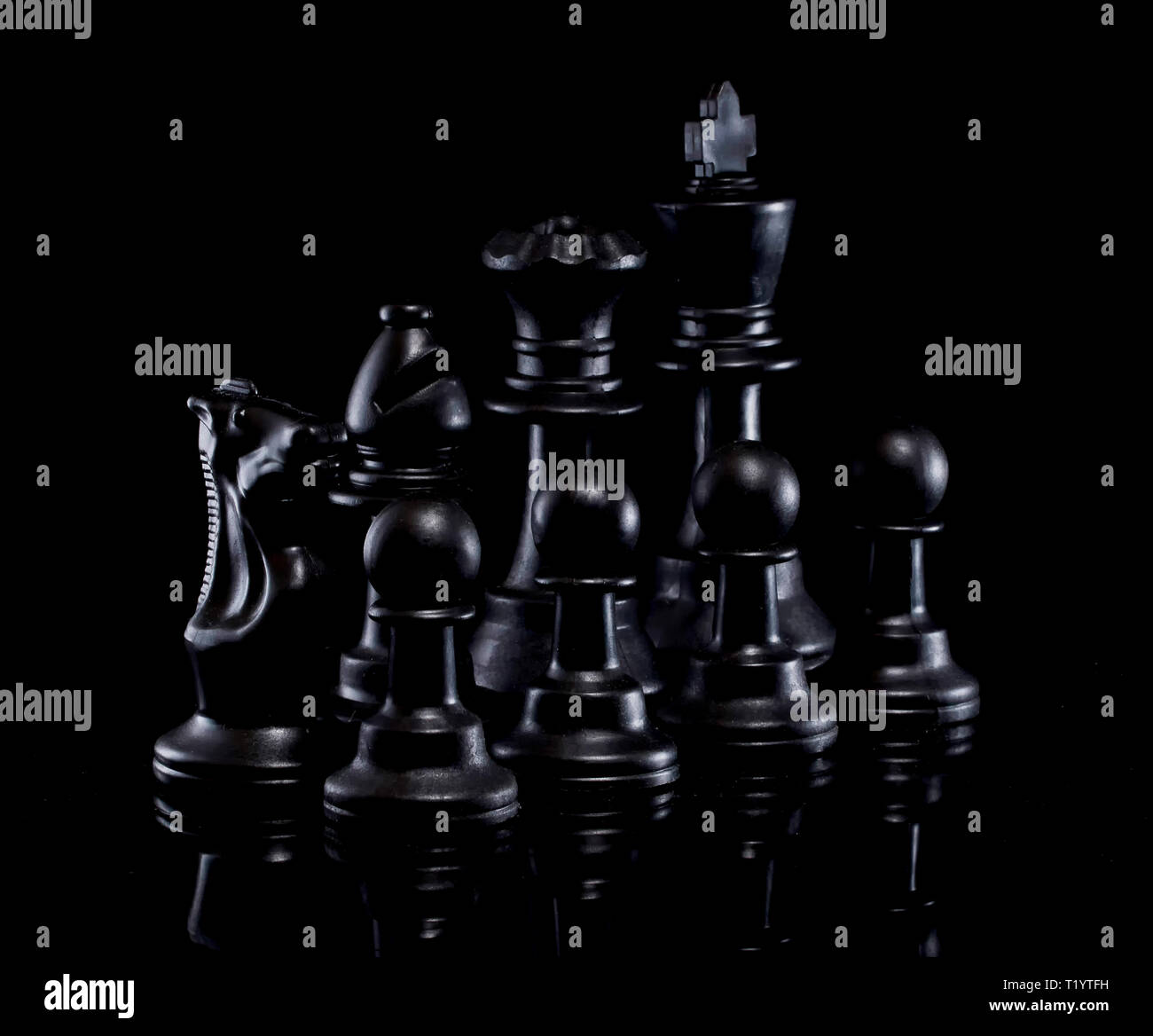 Chess pieces in low light Stock Photo