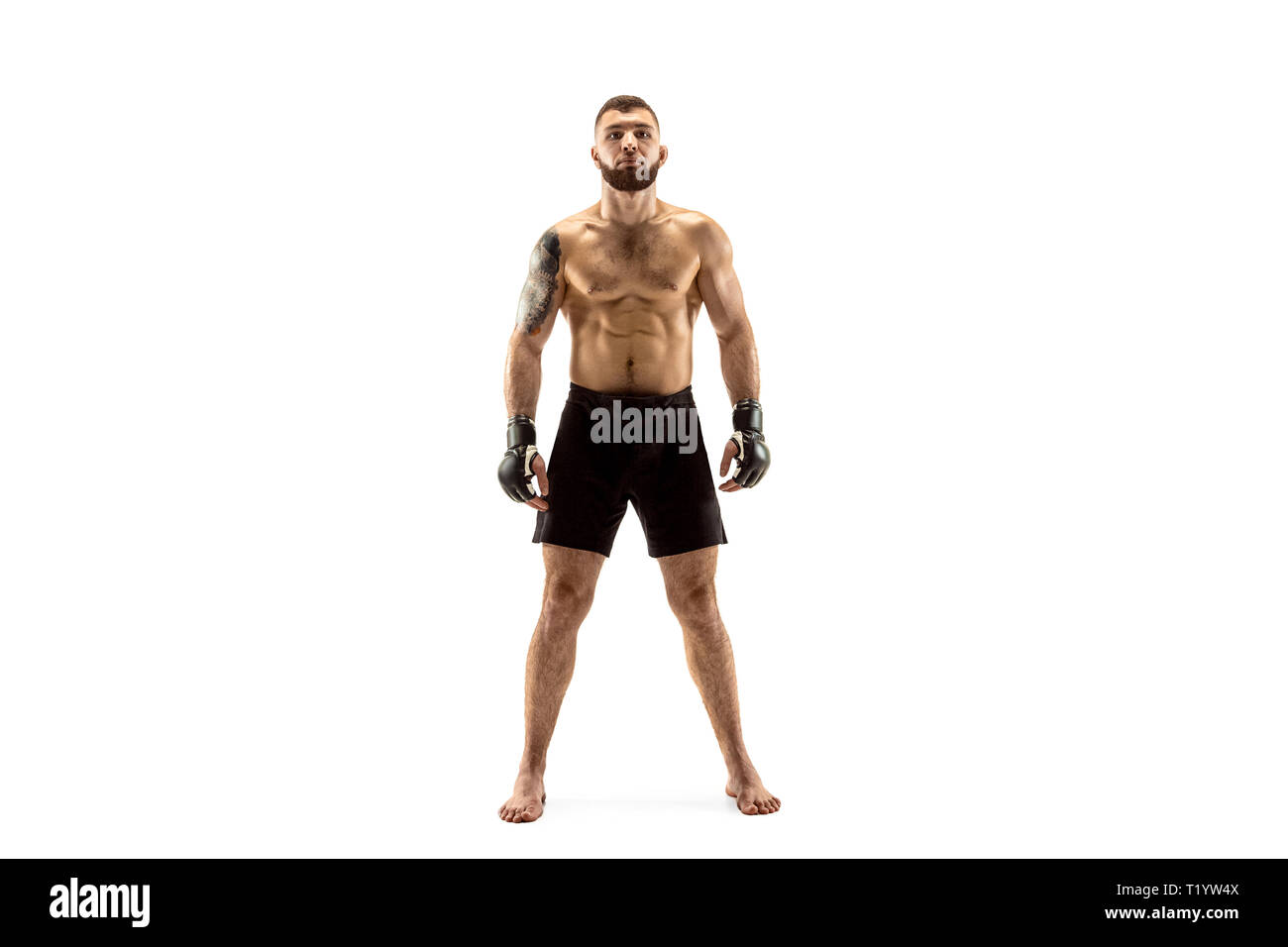 MMA. Professional fighter isolated on white studio background. Sport, competition, excitement and human emotions concept Stock Photo