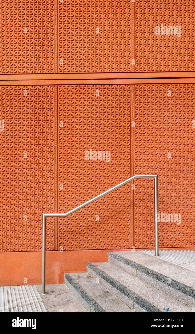 Stainless Steel Handrail Or Banister On Steps The Cladded Wall Of