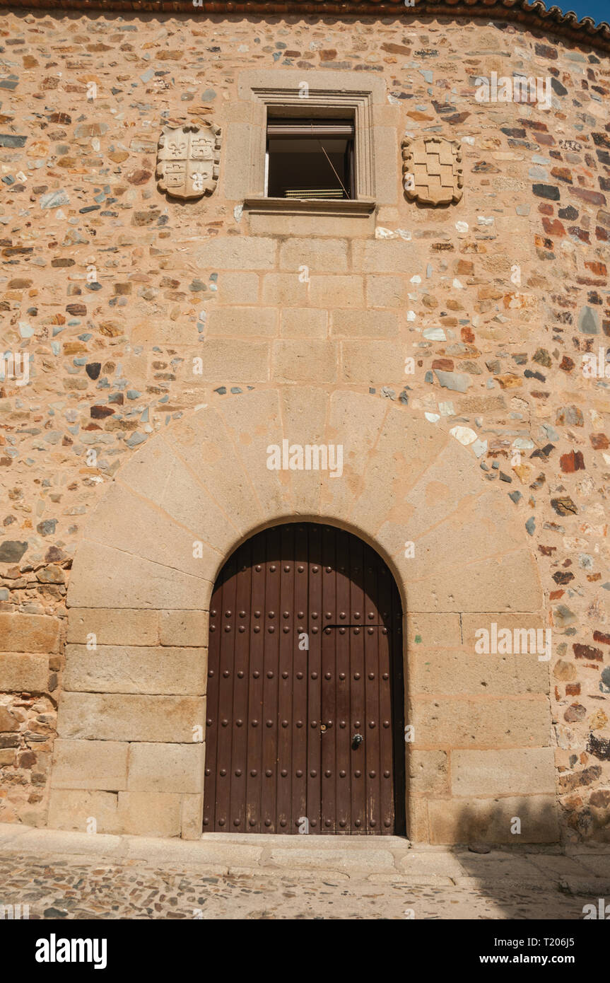 Wooden Door In Old Building Facade With Rounded Top Door