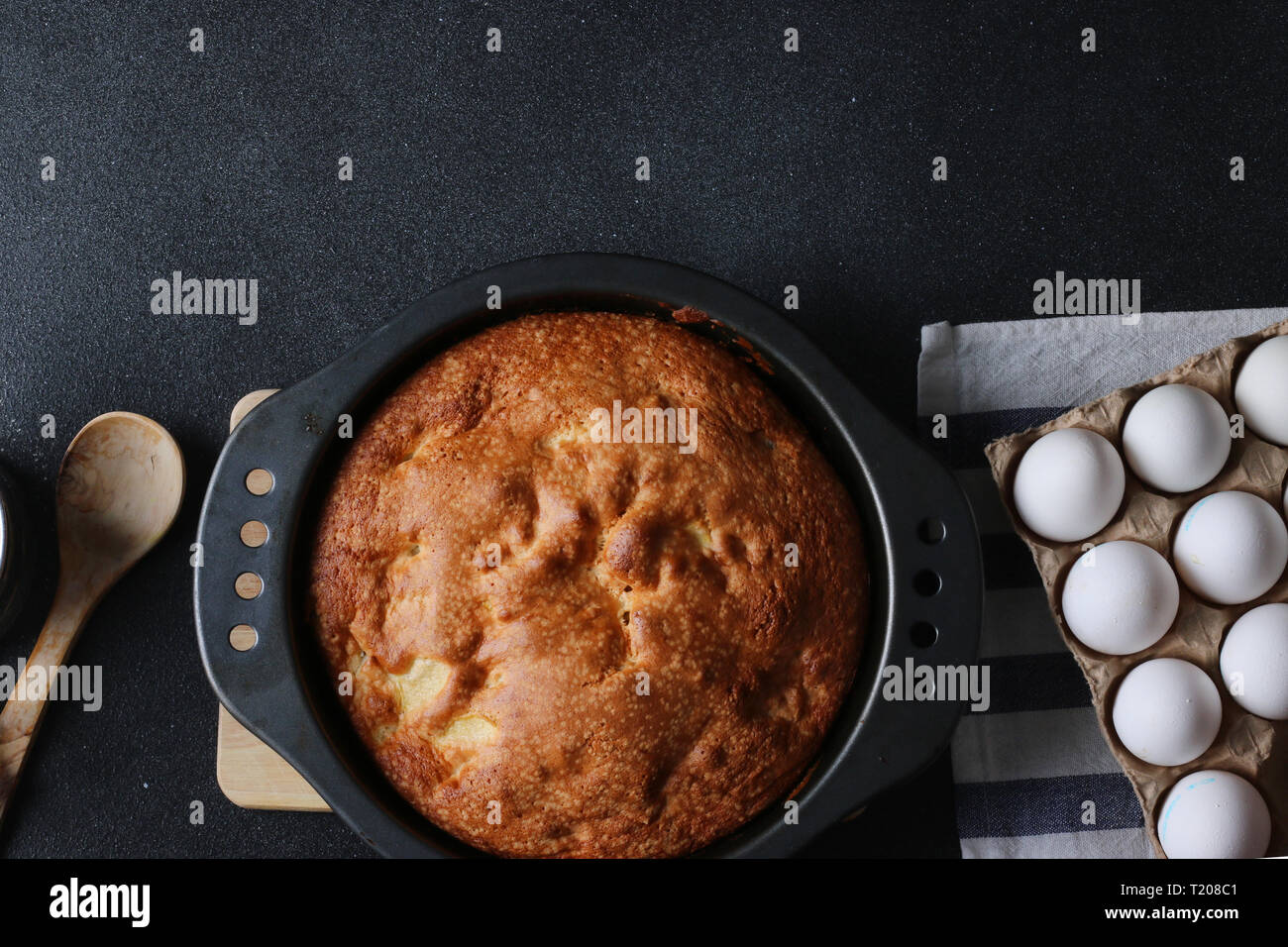 pie and ingredients for making on dark background top view. Stock Photo