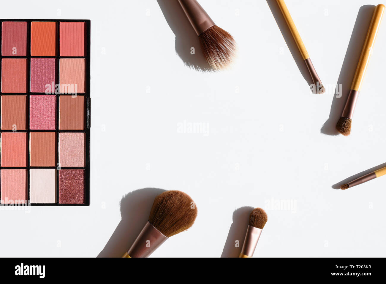 Top view of make up cosmetics and accessories. Eyeshadow palette and