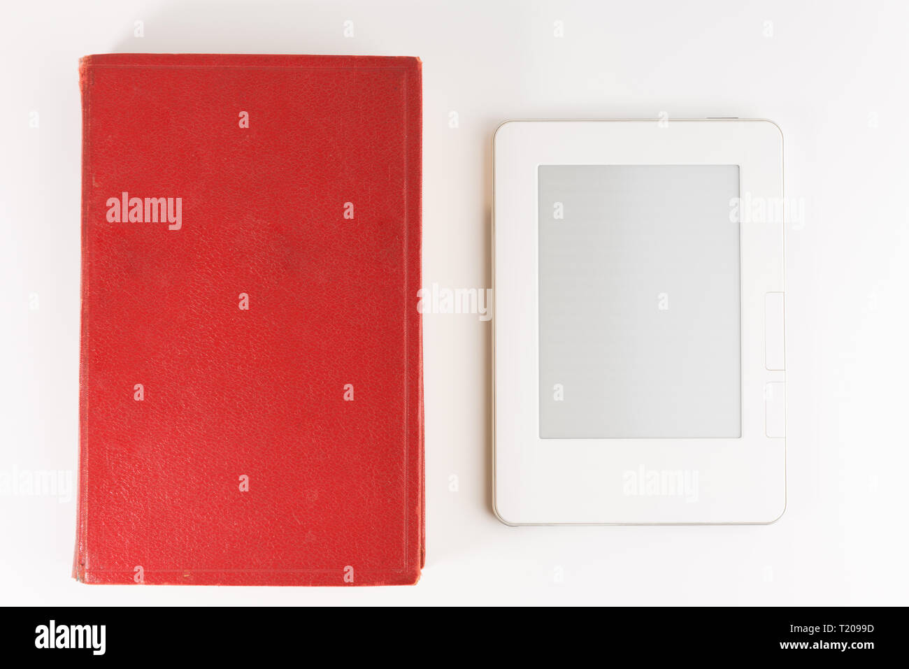Digital e-book reader with a blank screen with old paper book isolated on white background Stock Photo