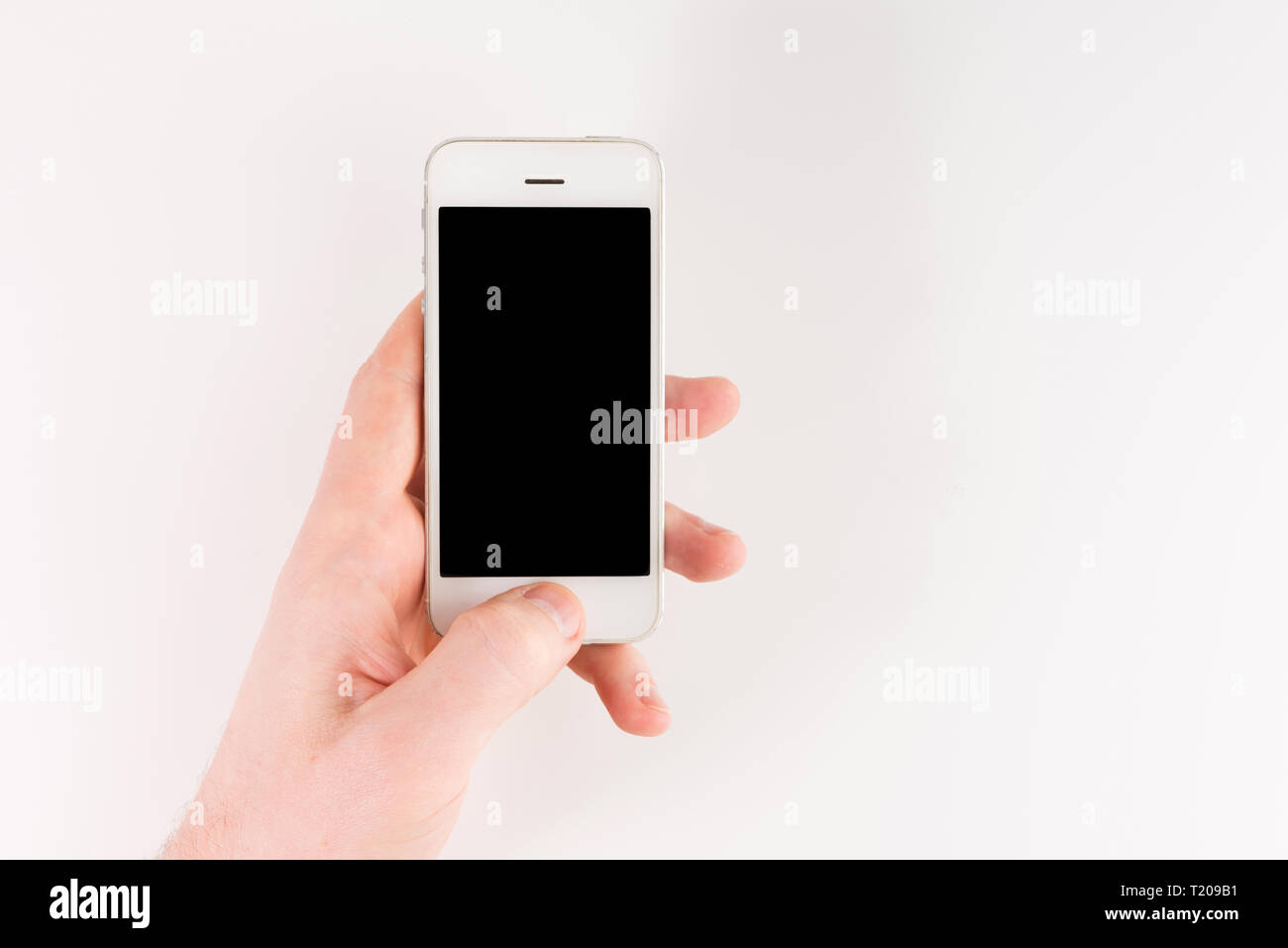Man hand holding white smartphone with blank screen, isolated on white ...