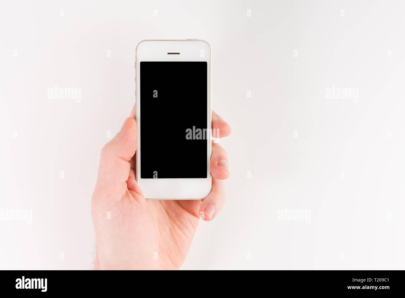 Man hand holding white smartphone with blank screen, isolated on white ...