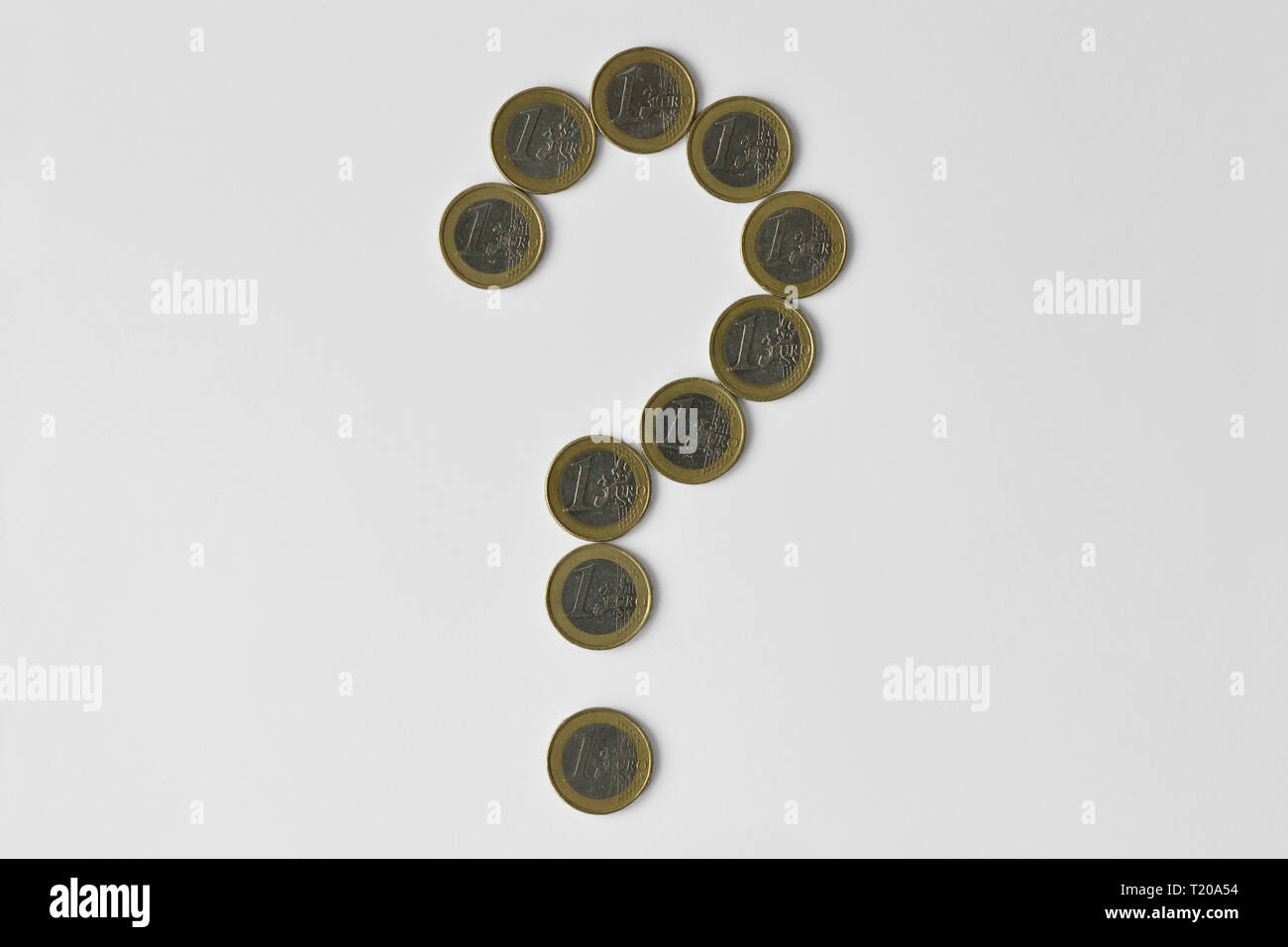 Question mark made of euro coins on white background - Concept of financial uncertainty, crisis and uncertain future of euro Stock Photo